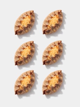 Karelian pies pattern on white background vertical