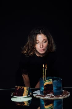 woman cuts a cake for a holiday pastry chef