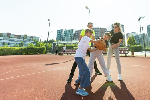 Time for family basketball. Family at basket playground. . High quality photo