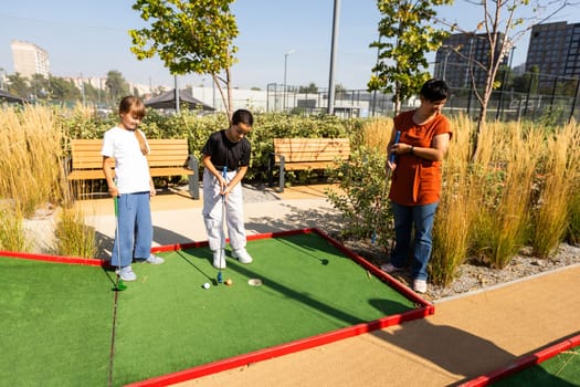 White golf ball rolling down golf hole on putting green with evening golf course backdrop . High quality photo