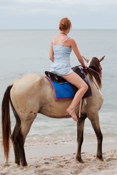 Girl rides horse