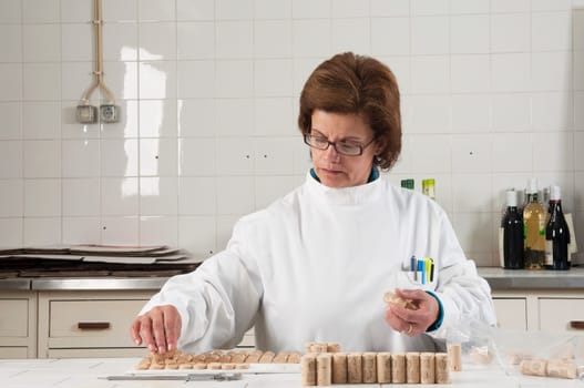 Woman checking cork stoppers