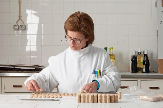 Woman checking cork stoppers