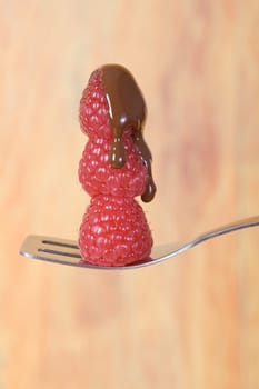 Three chocolate raspberries