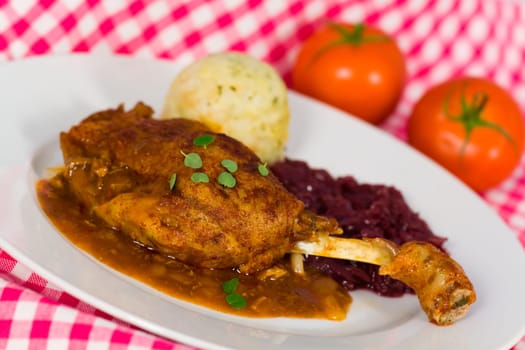 Duck leg with dumplings and red cabbage