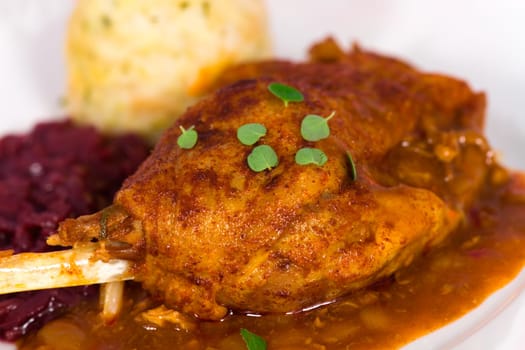 Duck leg with dumplings and red cabbage