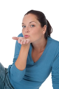 Brown hair woman blowing a kiss