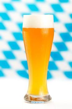Wheat beer against a Bavarian background