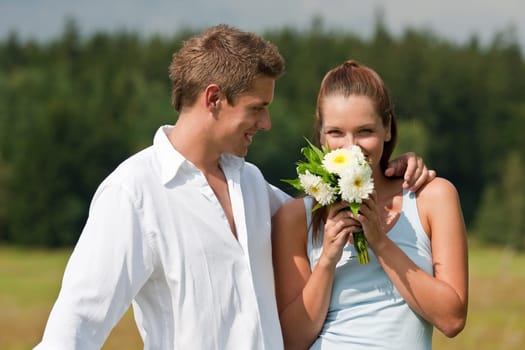 Romantic couple with flower in spring