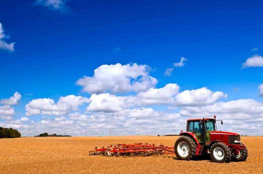 Tractor in plowed field