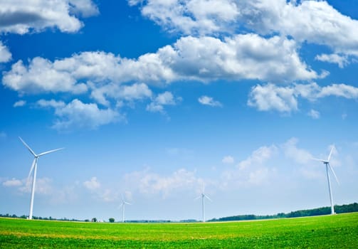 Wind turbines in field