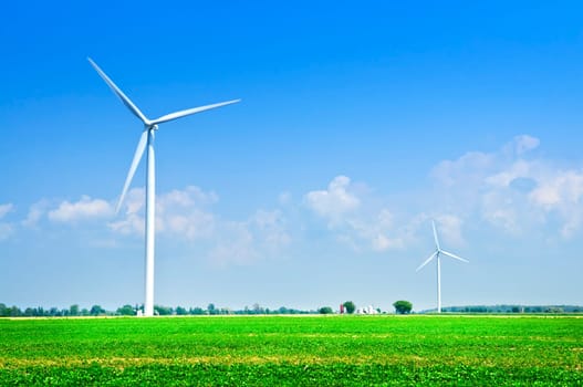 Wind turbines in field
