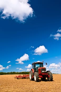 Tractor in plowed field