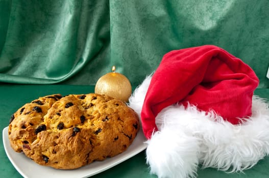 Panettone and hat of Santa Claus