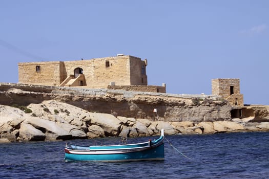Fishing boat and house in Gozo