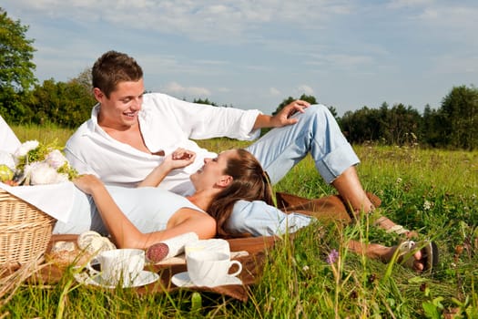Picnic - Romantic couple in spring nature