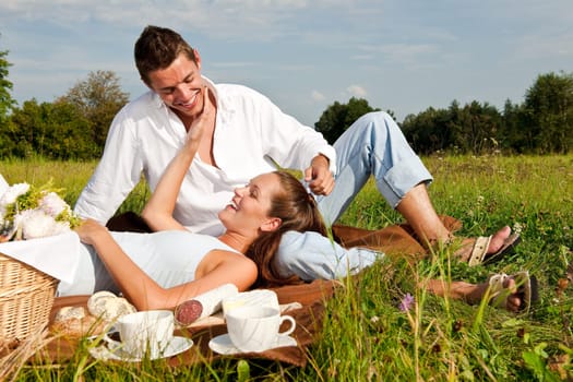 Picnic - Romantic couple in spring nature
