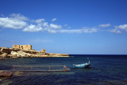 Fishing boat and house in Gozo