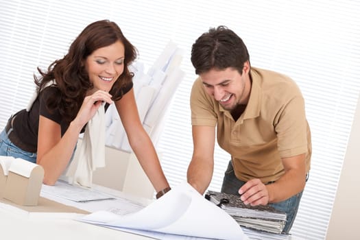 Man and woman at architect office working
