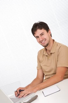Successful modern businessman with laptop
