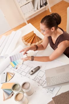 Female interior designer with color swatches