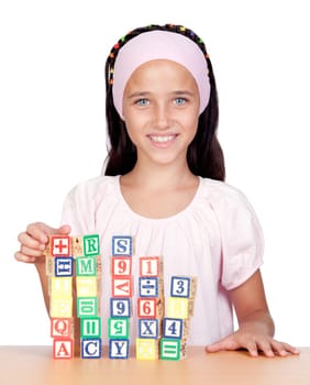 Little girl with wooden blocks stac