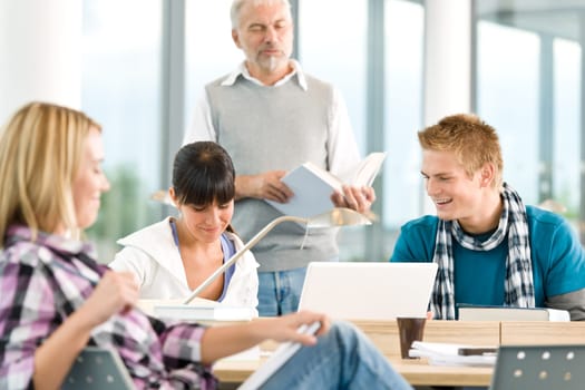 High school - three students with mature professor
