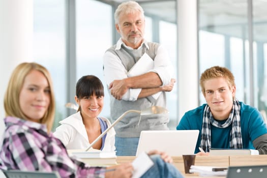 High school - three students with mature professor