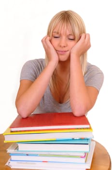 Woman sleeping on a pile of books