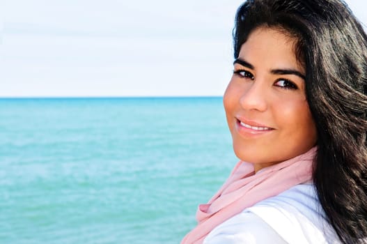 Beautiful young woman at beach