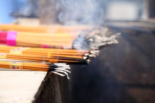 Burning incenses at a Buddhist temple