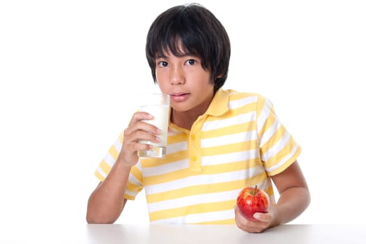 Boy with milk and apple