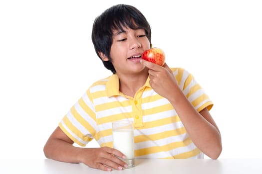 Boy with milk and apple