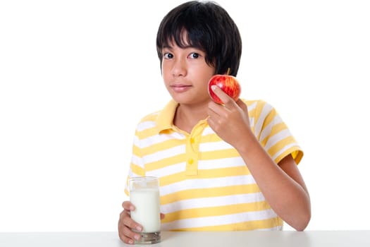 Boy with milk and apple