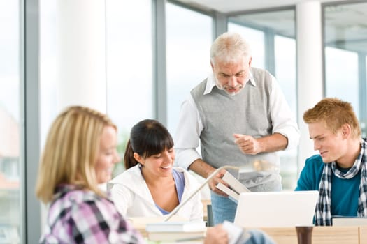 High school - three students with professor
