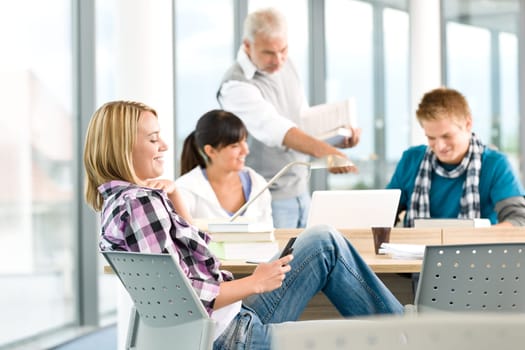 High school - three students with professor
