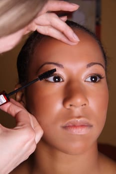 Woman putting on make-up