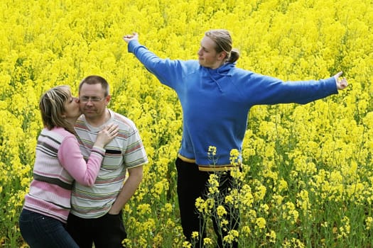 Three people in meadow