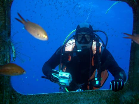 Wreck diver with camera