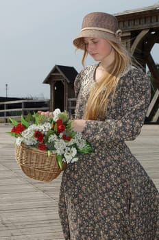 Girl with basket of flowers