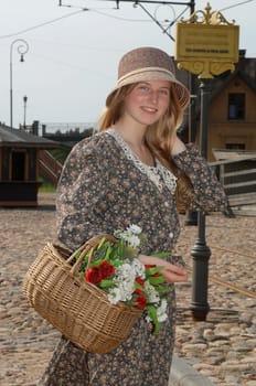 Girl with basket of flowers
