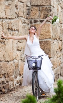 Bride  posing on bicycle
