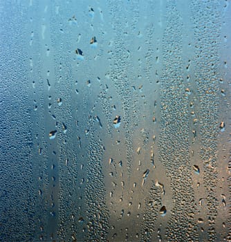 Colorful waterdrops on the window