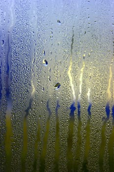 Colorful waterdrops on the window
