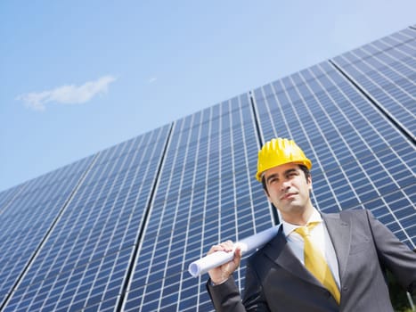 businessman and solar panels