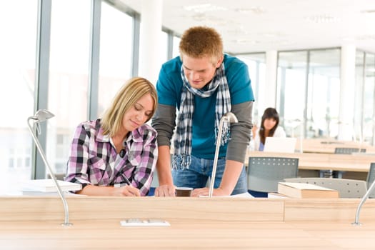 Three high school students in classroom