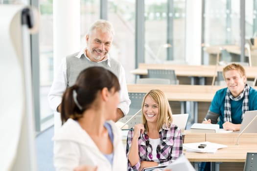 High school - three students with mature professor