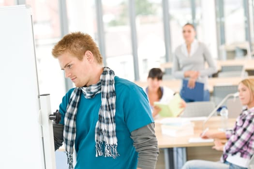 Three high school students in classroom