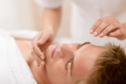 Male beauty - man receiving facial massage