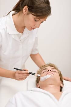 Male cosmetics - facial mask in salon